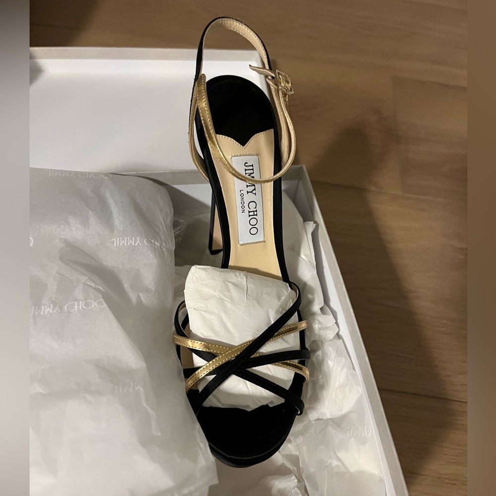 Brand new, never worn Jimmy Choo black and gold heels